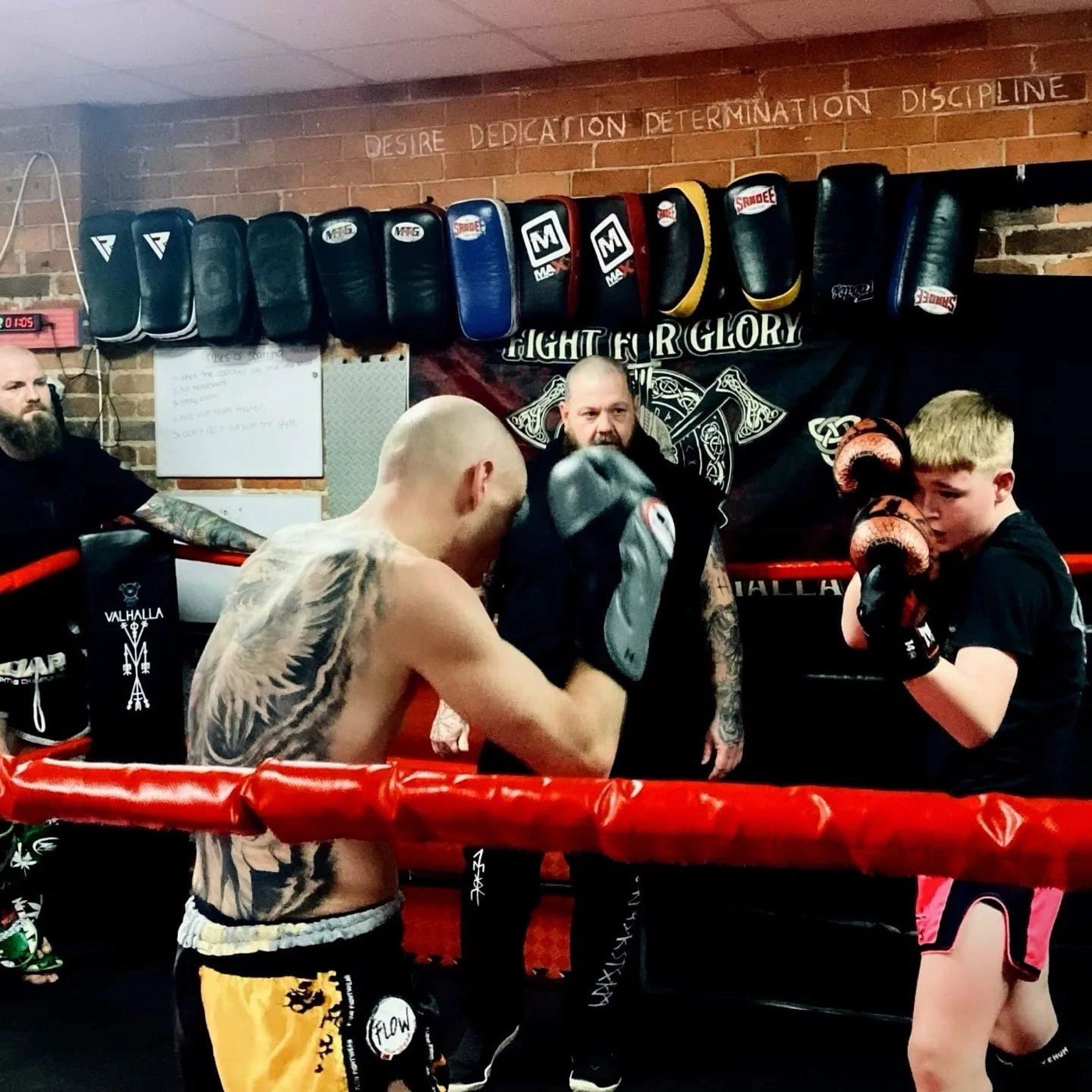 Fighters celebrating a win at a Valhalla Martial Arts fight night