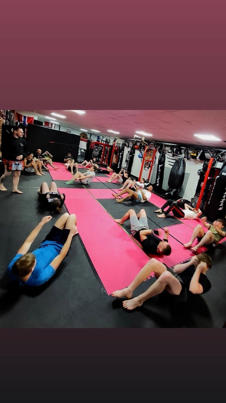 Fighters celebrating a win at a Valhalla Martial Arts fight night